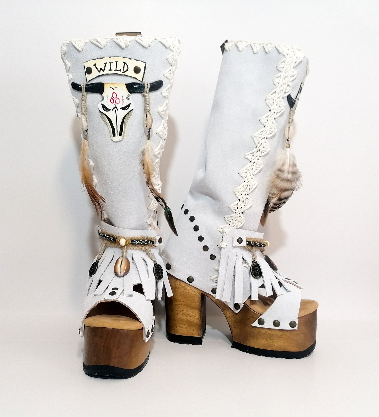 White suede leather platform boots sandals, with hand painted buffalo, decorated with feathers, natural shells, coins and horns, totally handmade to order. An authentic bohemian style boot handmade by Sol Caleyo. Sizes 34 to 47.