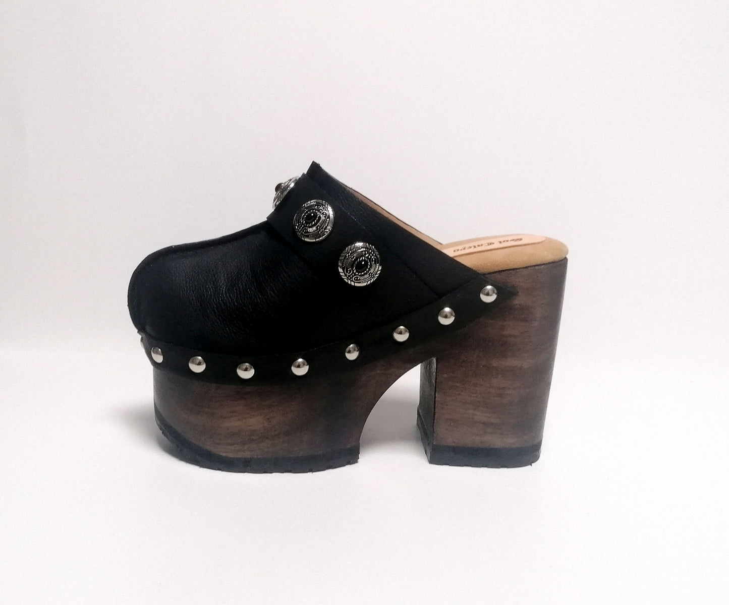 Vintage style black leather clogs. Super high heel clog decorated with vintage silver conchos. Bohemian style mule. Vintage 70's style platform clogs. Sizes 34 to 47. High quality leather shoes handmade by sol Caleyo. Sustainable fashion.