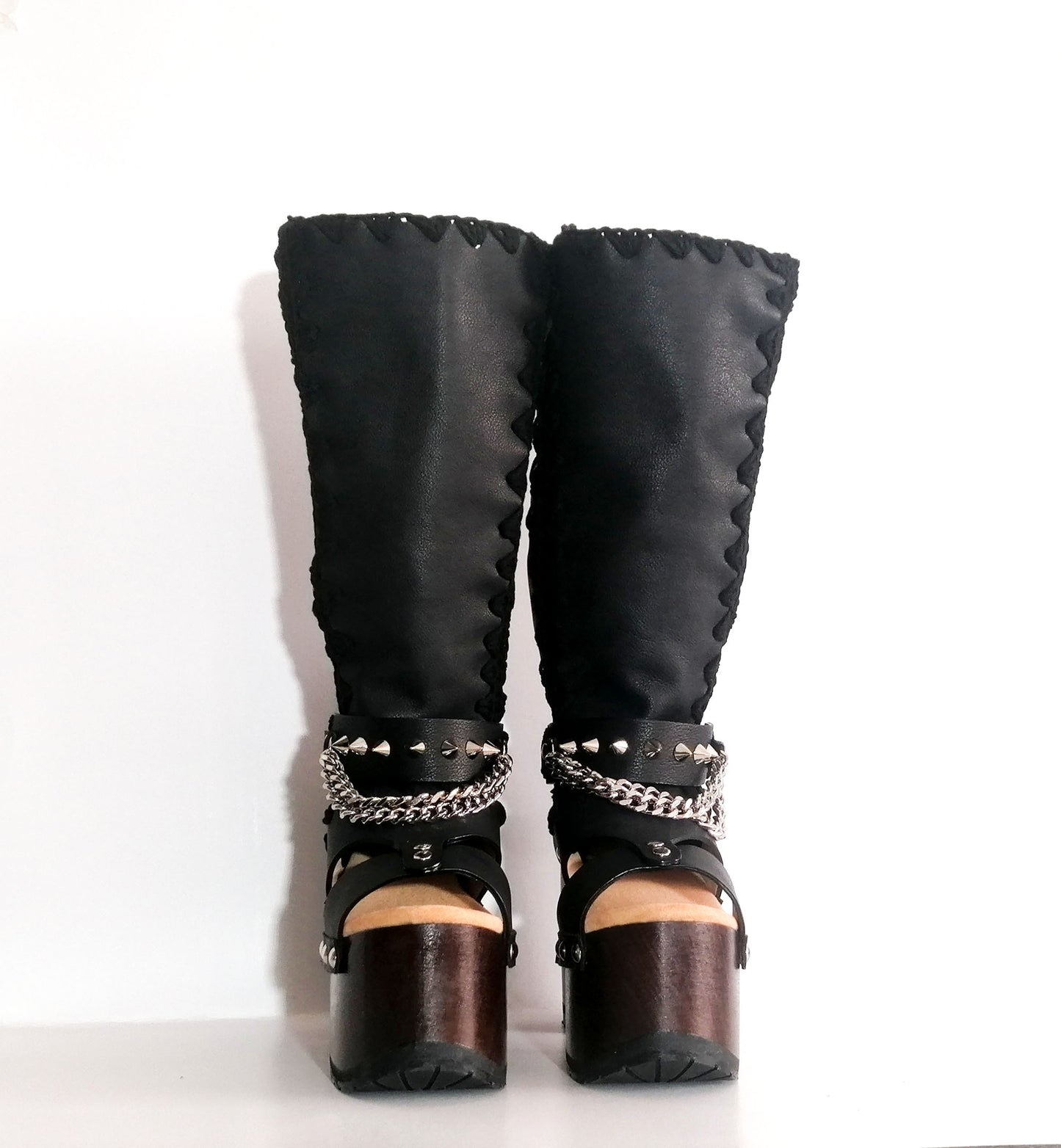 Black platform sandal with super high heel. Black super high heel platform boot with studs and silver chains. Super high heel biker style boot. Sizes 34 to 47. Handmade leather shoes by sol Caleyo.