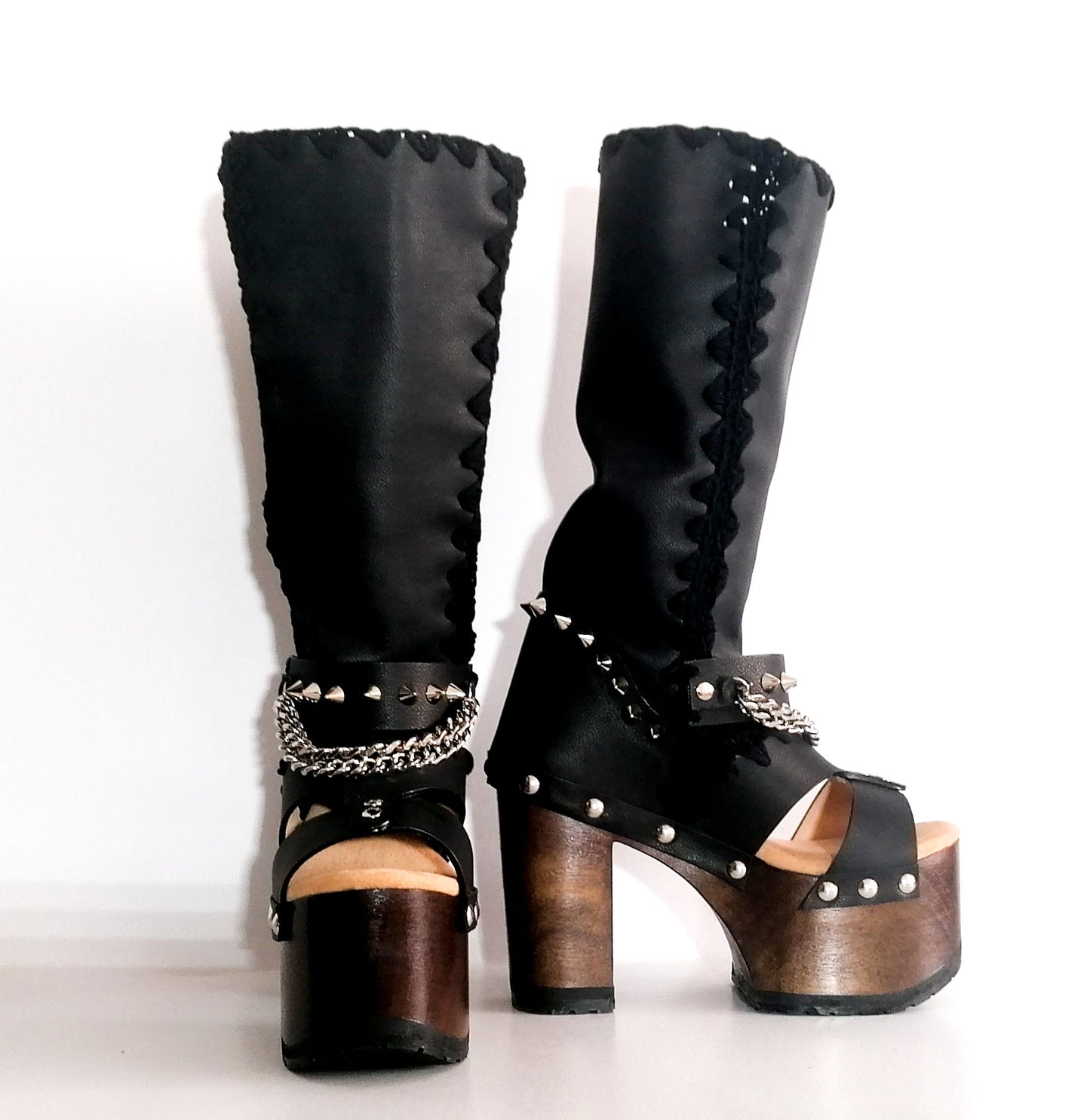 Black platform sandal with super high heel. Black super high heel platform boot with studs and silver chains. Super high heel biker style boot. Sizes 34 to 47. Handmade leather shoes by sol Caleyo.
