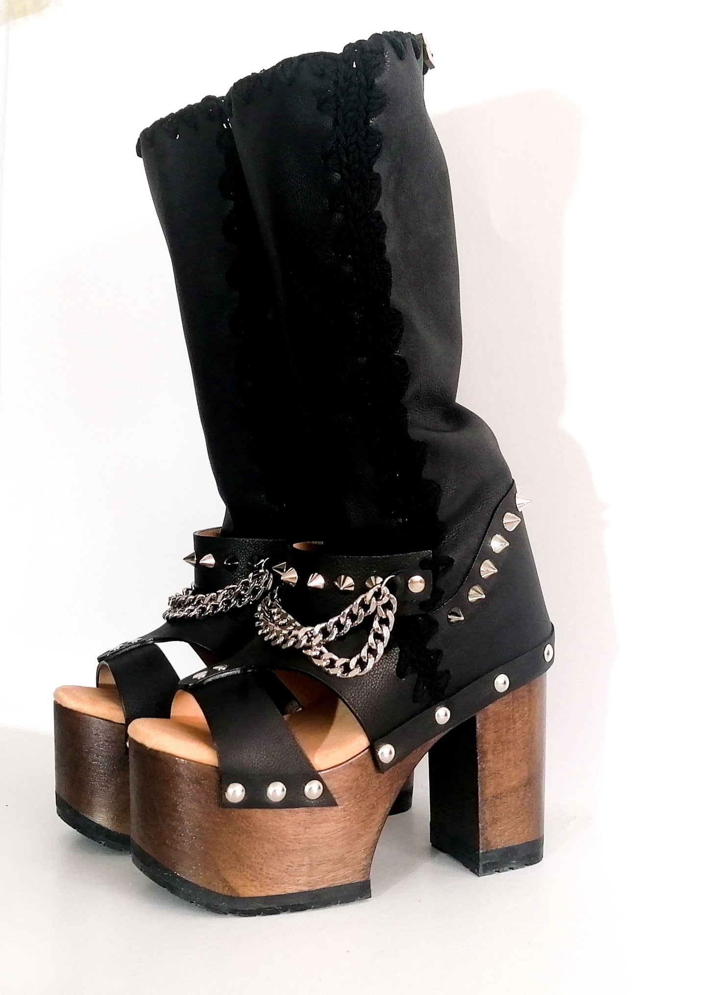Black platform sandal with super high heel. Black super high heel platform boot with studs and silver chains. Super high heel biker style boot. Sizes 34 to 47. Handmade leather shoes by sol Caleyo.