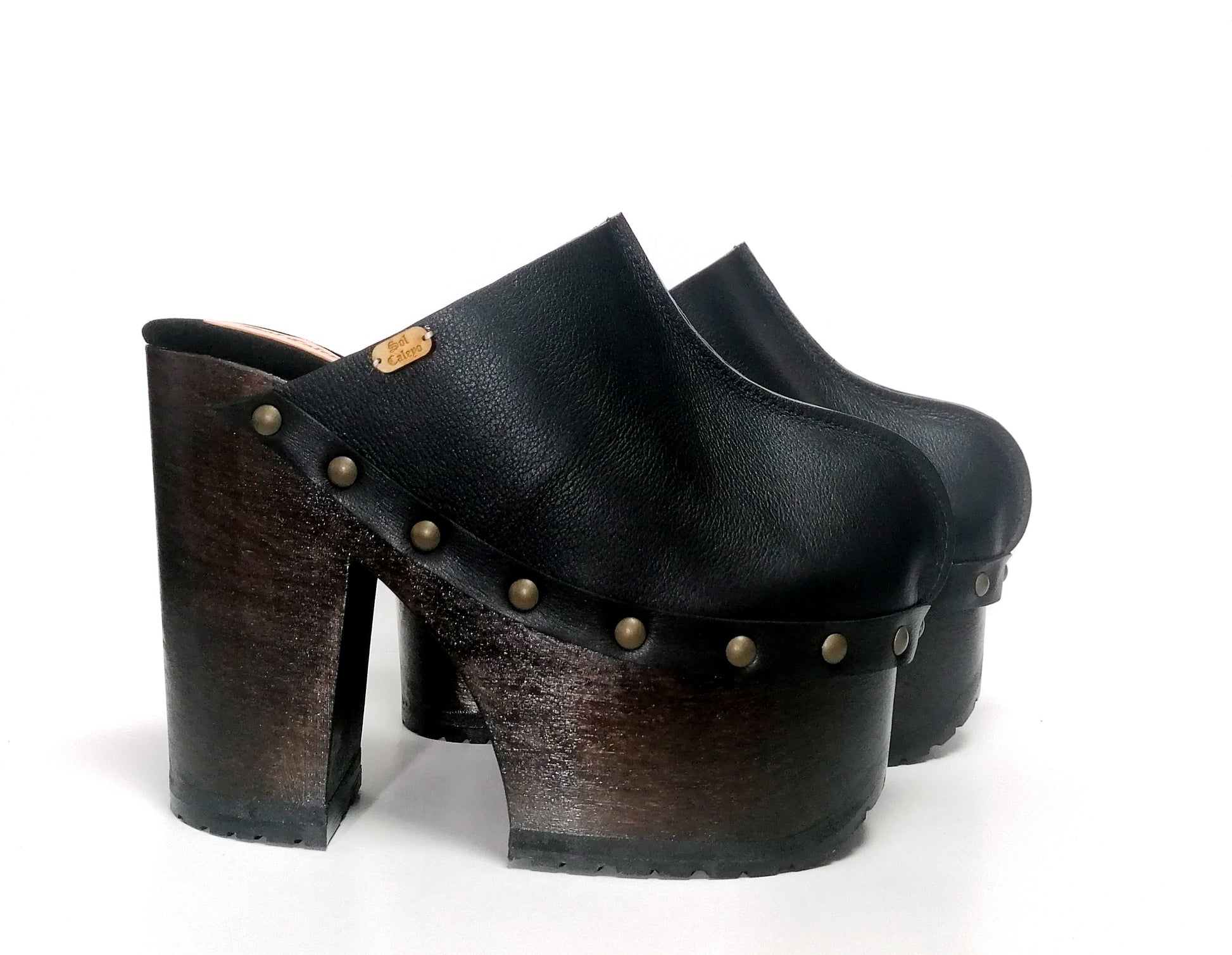 Black leather clogs with platform and super high heel. Leather mule with super high wooden heel. Black leather clogs 70's vintage style. Vintage style super high heel clogs. Sizes 34 to 47. High quality leather shoes handmade by sol Caleyo. Sustainable fashion.