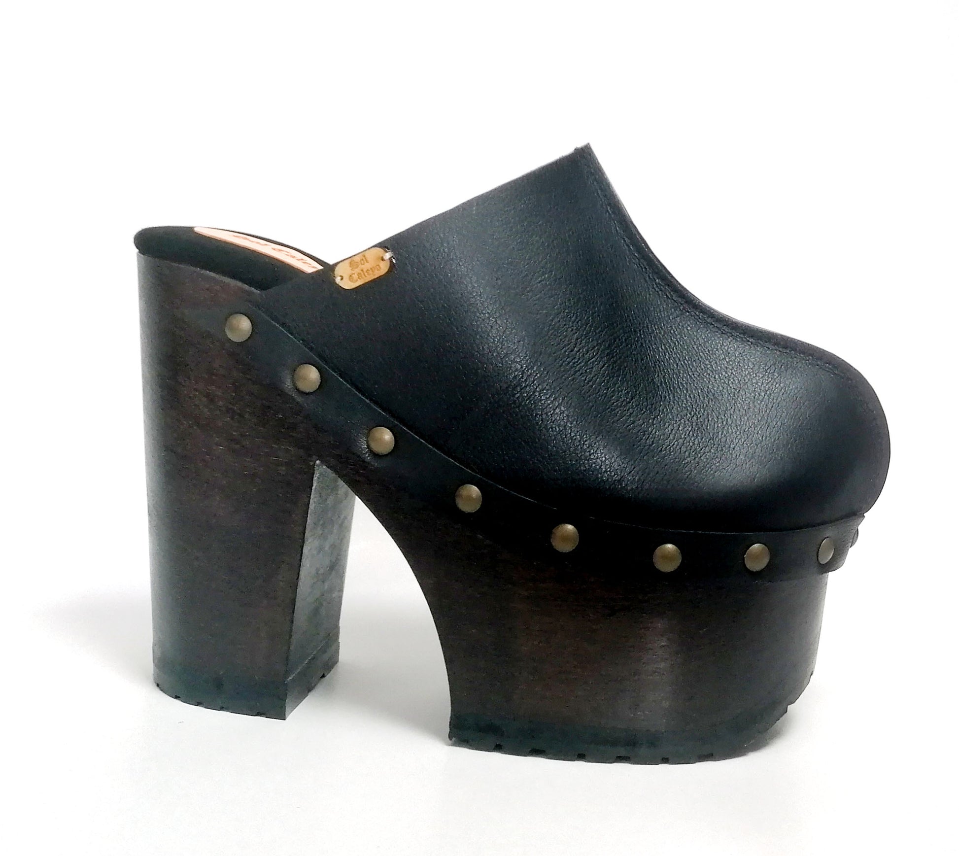 Black leather clogs with platform and super high heel. Leather mule with super high wooden heel. Black leather clogs 70's vintage style. Vintage style super high heel clogs. Sizes 34 to 47. High quality leather shoes handmade by sol Caleyo. Sustainable fashion.