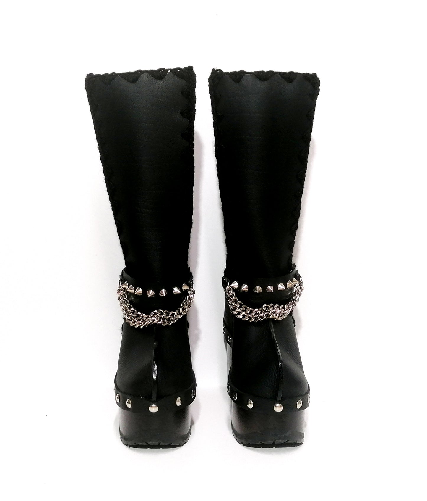 Black leather clog boots with wooden heel. Black leather boots with silver studded chains decoration, biker style. Leather boots with wooden heel and platform. Sizes 34 to 47. Handmade leather shoes of excellent quality by Sol Caleyo.