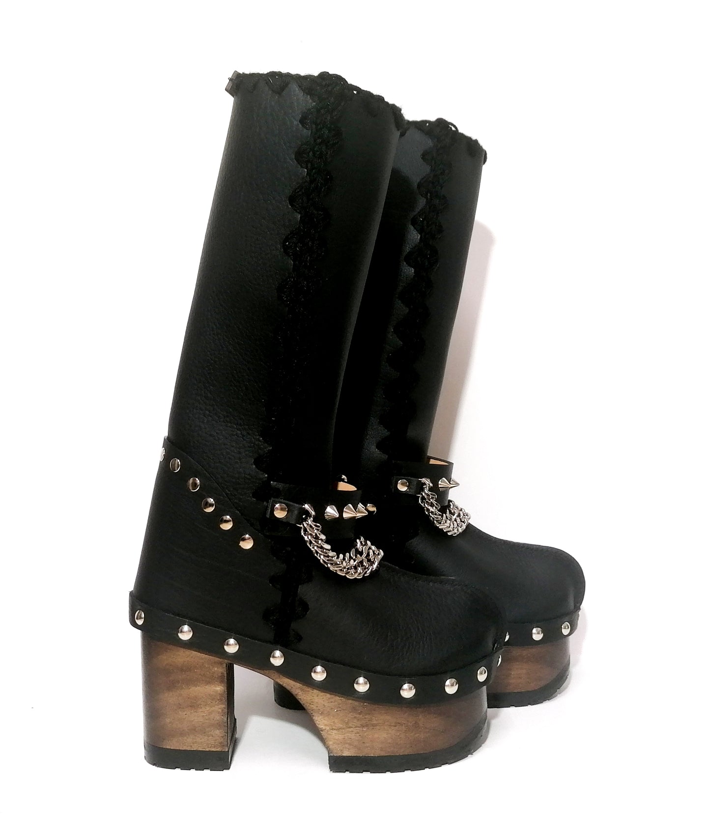 Black leather clog boots with wooden heel. Black leather boots with silver studded chains decoration, biker style. Leather boots with wooden heel and platform. Sizes 34 to 47. Handmade leather shoes of excellent quality by Sol Caleyo.