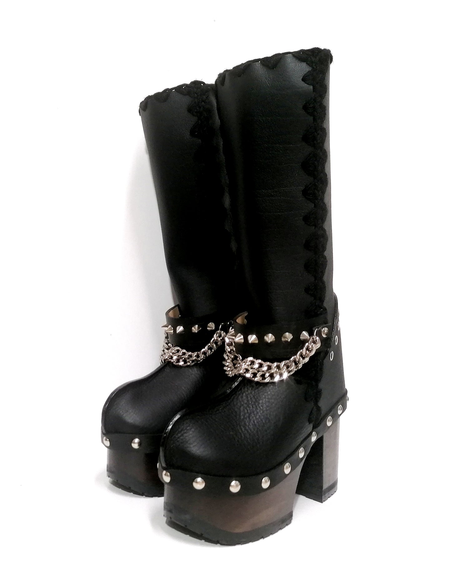 Black leather clog boots with wooden heel. Black leather boots with silver studded chains decoration, biker style. Leather boots with wooden heel and platform. Sizes 34 to 47. Handmade leather shoes of excellent quality by Sol Caleyo.