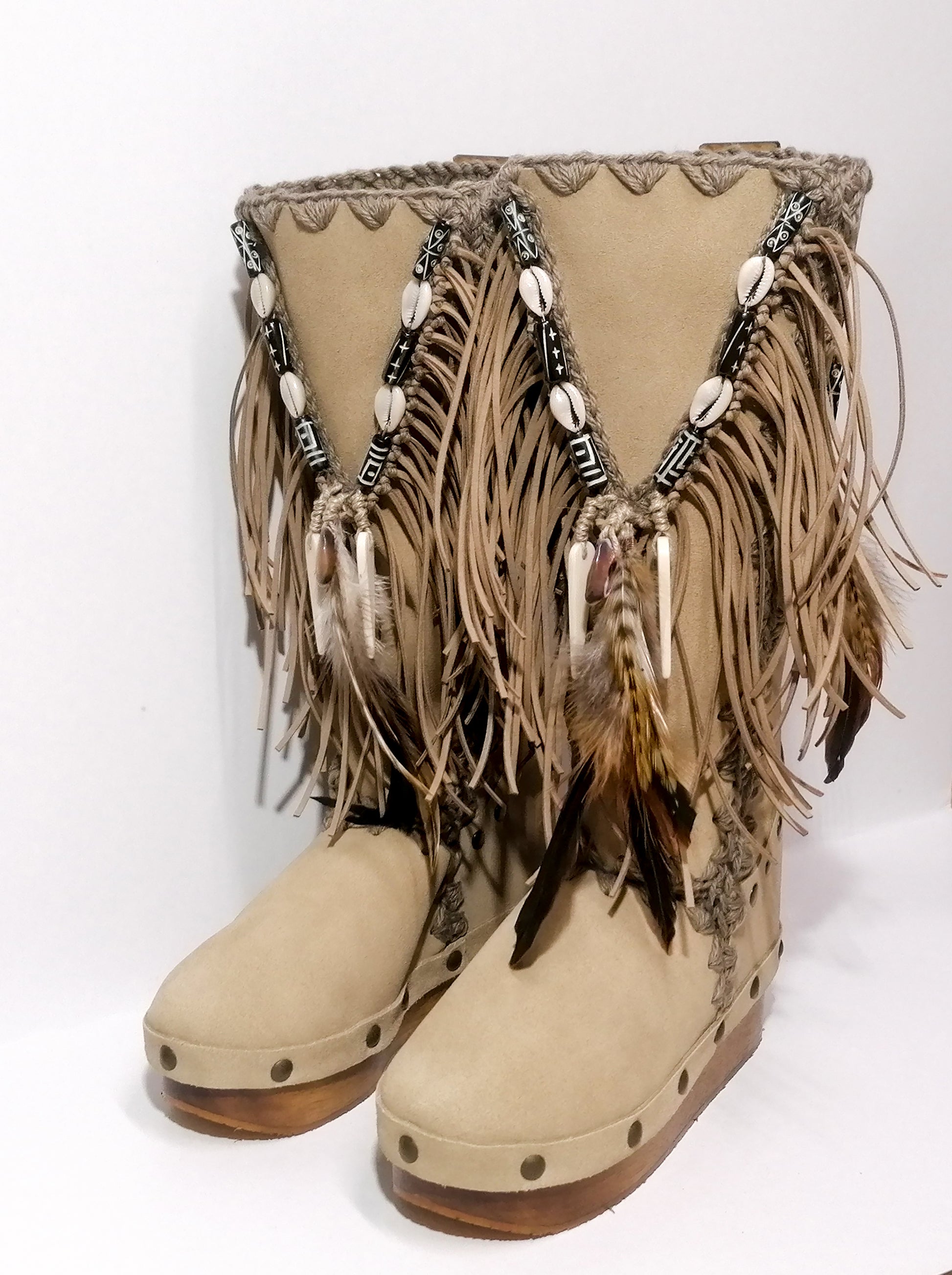 Wooden clog boot. Suede leather boot decorated with fringes, natural shells, feathers, horns and hand painted buffalo. Bohemian style boot with wooden wedge. Sizes 34 to 47. High quality leather footwear handmade by sol Caleyo. Sustainable fashion.