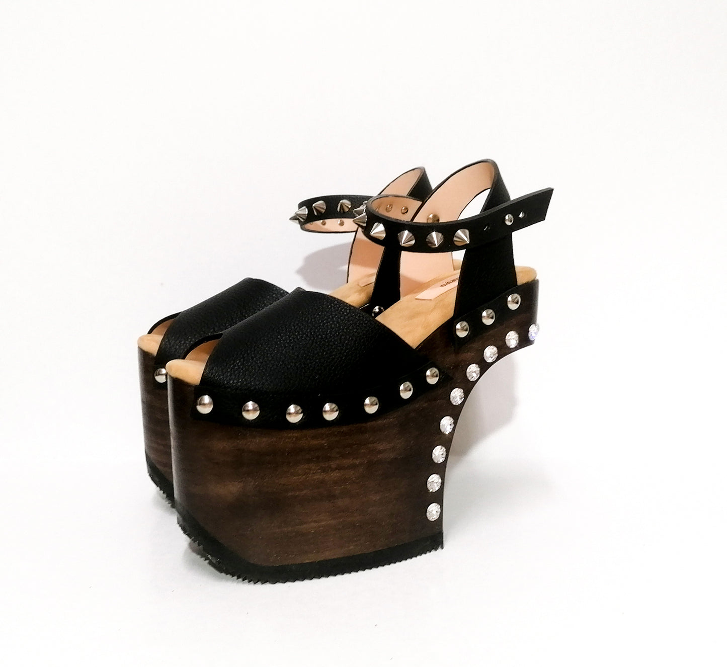 Black leather platform sandal with silver studs. Wooden wedge heel in C decorated with swarovski crystals. Super high heel sandal with genuine swarovski crystals. Super high heel sandal without heel. Sizes 34 to 47. High quality leather shoes handmade by sol Caleyo. Sustainable fashion.