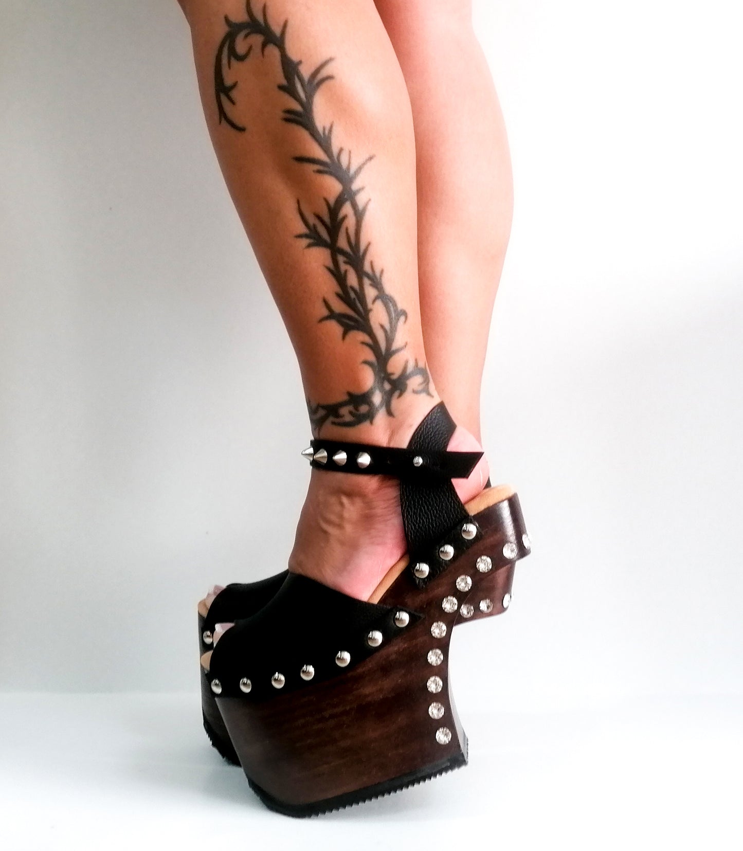 Black leather platform sandal with silver studs. Wooden wedge heel in C decorated with swarovski crystals. Super high heel sandal with genuine swarovski crystals. Super high heel sandal without heel. Sizes 34 to 47. High quality leather shoes handmade by sol Caleyo. Sustainable fashion.