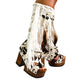 Handmade cowboy boots, white boots with cowhide and fringes. Cowboy style boots with hand painted buffalo, feathers, coins and natural shells. Vintage style platform boots. High-end leather footwear handmade by Sol Caleyo.