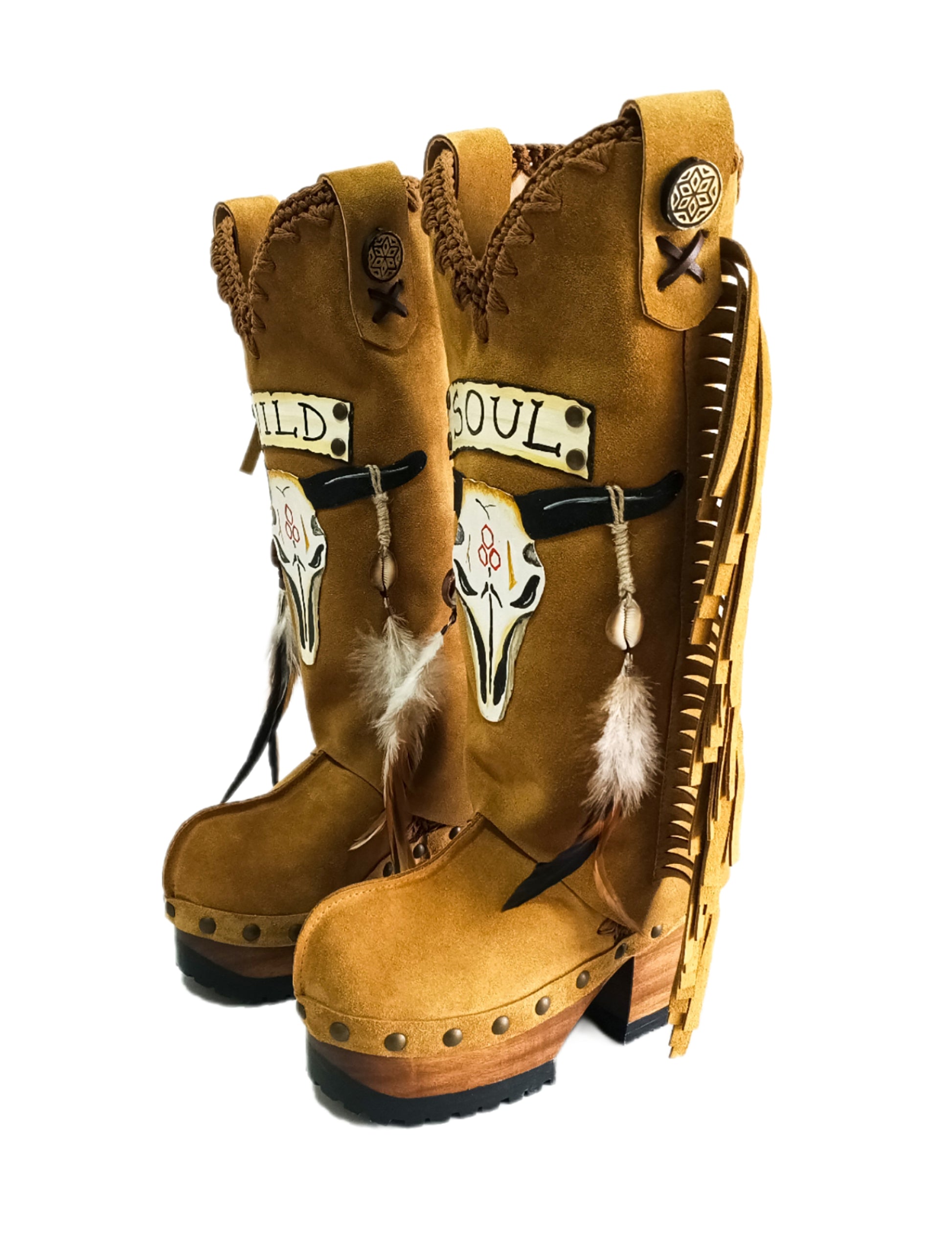 Camel suede cowboy boots. Clogs with hand-painted buffalo head, feathers, and fringes. Bohemian-style boots. High-end footwear handmade by Sol Caleyo.