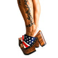 Sandals with a unique American flag design. Vintage-style platform sandals with wooden heels. Heels with a unique American flag design. High-end footwear handmade to order. Exclusive design by Sol Caleyo.