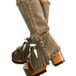 Bohemian-style boots in earth-colored suede leather. Bohemian-style platform boots, decorated with horns, fringes, feathers, and shells. High-end footwear handmade to order. Exclusive design by Sol Caleyo.