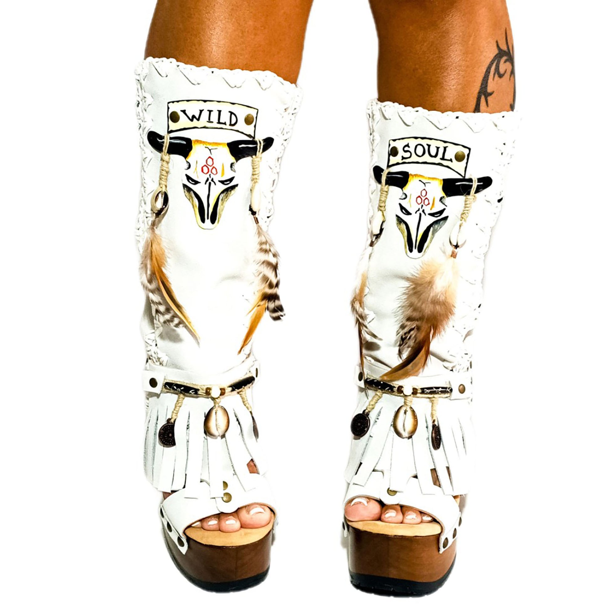 White suede leather platform boots sandals, with hand painted buffalo, decorated with feathers, natural shells, coins and horns, totally handmade to order. An authentic bohemian style boot handmade by Sol Caleyo. Sizes 34 to 47.