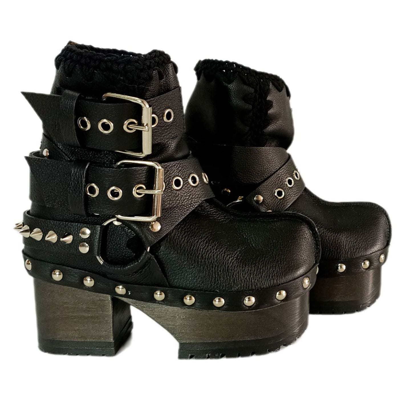 Black leather platform boots with silver studs. Black leather biker style boots with buckles. Black leather ankle boots with vintage style buckles. Leather boots with wooden heel. High-end handmade footwear by Sol Caleyo.