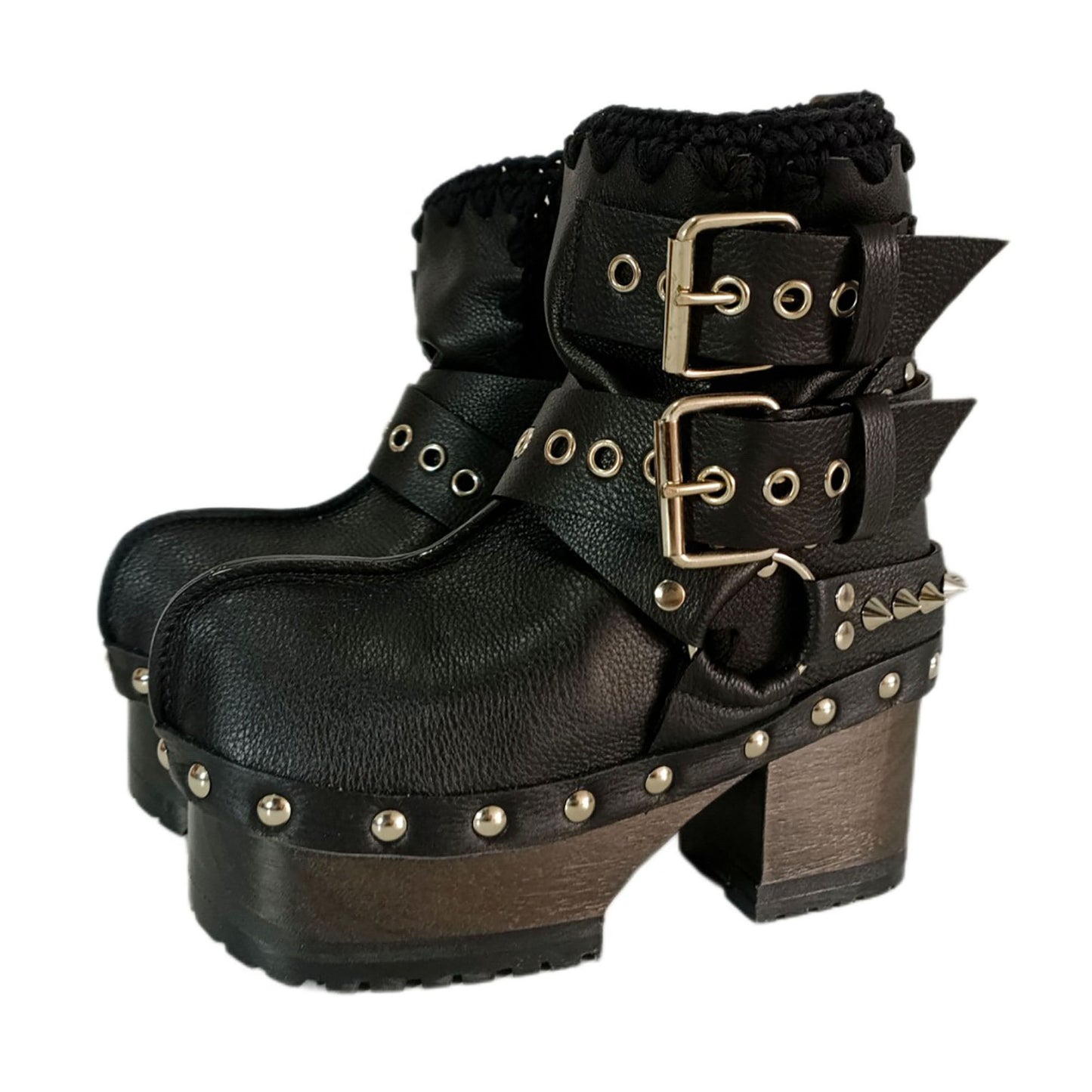 Black leather platform boots with silver studs. Black leather biker style boots with buckles. Black leather ankle boots with vintage style buckles. Leather boots with wooden heel. High-end handmade footwear by Sol Caleyo.