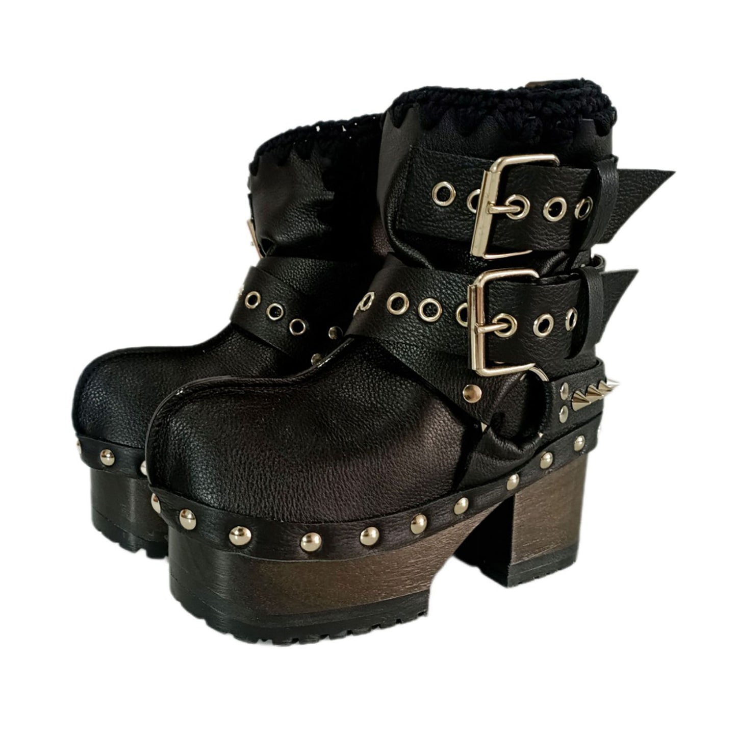 Black leather platform boots with silver studs. Black leather biker style boots with buckles. Black leather ankle boots with vintage style buckles. Leather boots with wooden heel. High-end handmade footwear by Sol Caleyo.