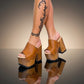 Handmade brown leather sandals, inspired by the iconic 70s style.
Crafted to order with a wooden heel and a timeless silhouette.
Available from size 34 to 47.
An exclusive design by Sol Caleyo, made for those who value craftsmanship, comfort, and authentic style.
