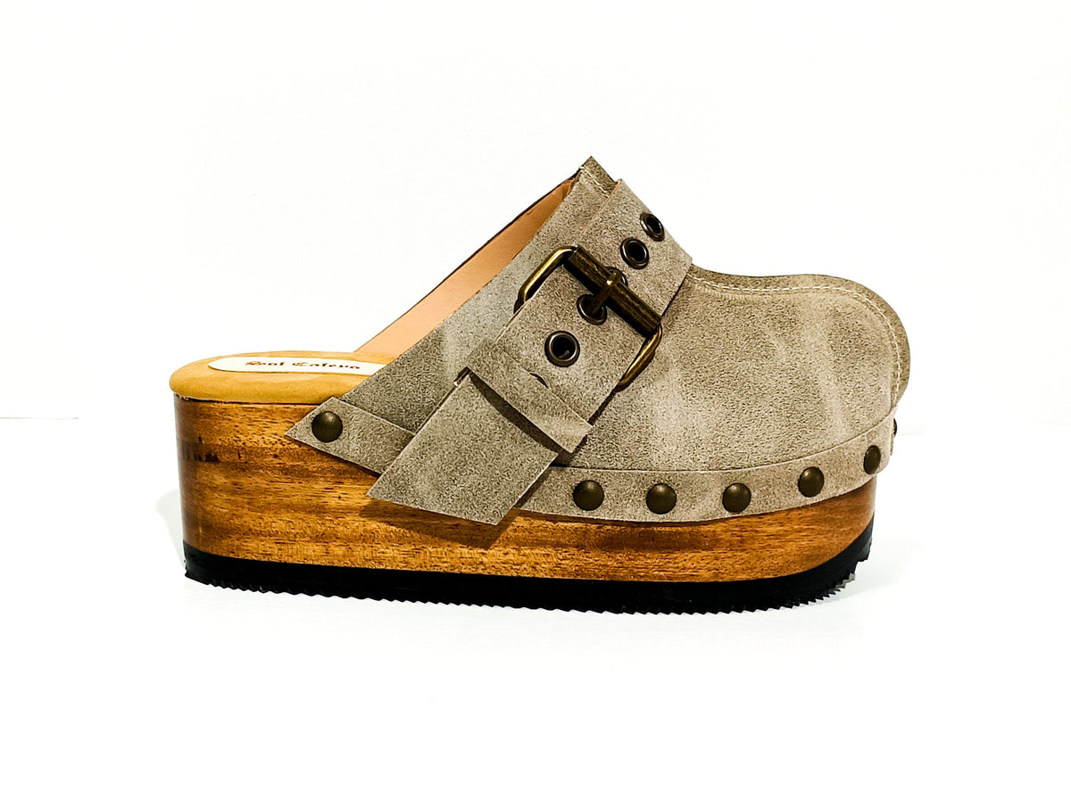 Aged stone handmade leather open-back wedge mule clogs with antique-gold studs and buckle by Sol Caleyo.