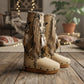 V-shaped fringe with shells, horns and feathers on the front of boho wedge boots.