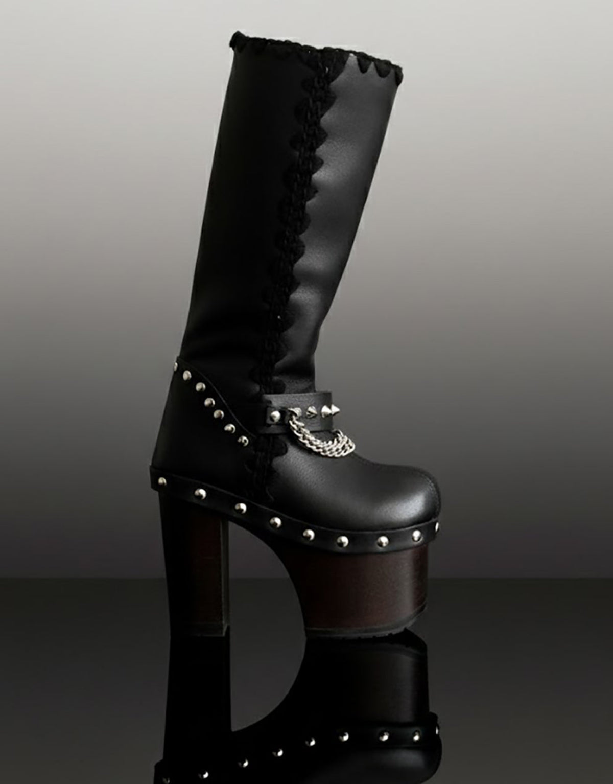 Handmade leather platform boots with silver pyramid studs, chains and 15 cm wenge wooden heel by Sol Caleyo