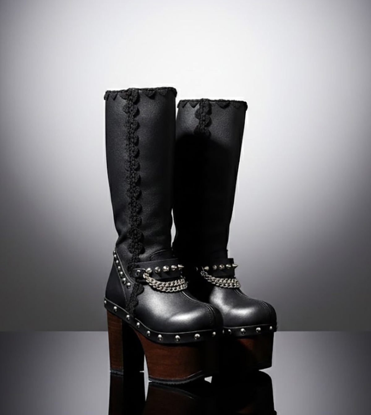 Handmade leather platform boots with silver pyramid studs, chains and 15 cm wenge wooden heel by Sol Caleyo