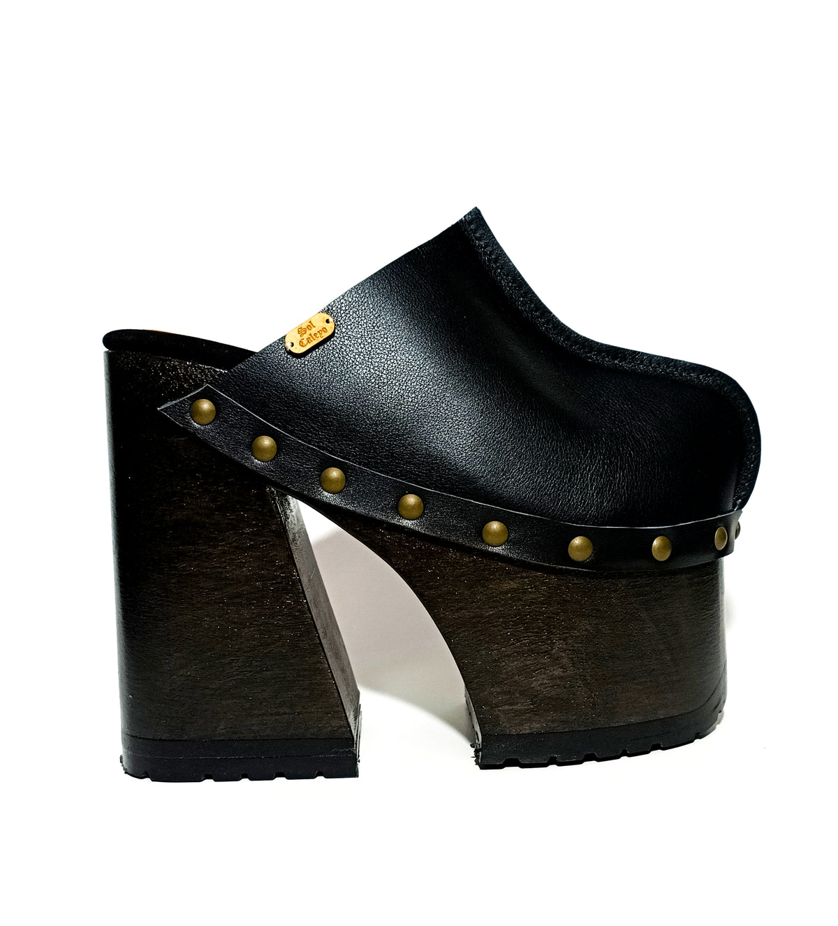 Handmade smooth black leather closed-toe mule clogs with old-gold studs and 16 cm wenge lacquered bell-shaped wooden heel by Sol Caleyo.
