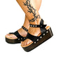 Handmade black leather wedge flip flop sandals with ankle strap, silver pyramid studs and 6 cm wenge lacquered wooden wedge by Sol Caleyo.