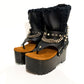 Handmade black leather flip flop wedge booties with silver pyramid studs, chains and 10 cm wooden wedge by Sol Caleyo.