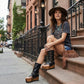 Handmade black leather flip flop wedge boots with old-gold pyramid studs, buckles and 10 cm wooden wedge by Sol Caleyo.