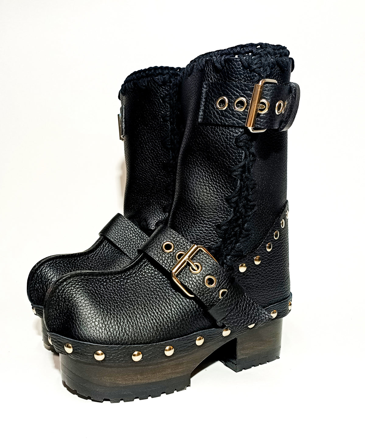 Handmade smooth black leather mid-calf platform boots with silver buckles, rivets and 6.5 cm wenge lacquered wooden heel by Sol Caleyo.