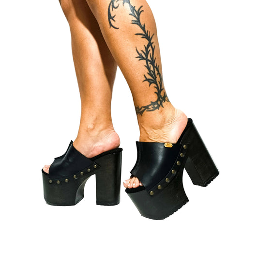 Handmade smooth leather open toe platform mule sandals with wide strap, round flat old-gold studs and 15 cm wenge lacquered wooden heel by Sol Caleyo.