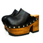 Handmade black leather closed-toe platform mule clogs with round flat silver studs and 12 cm straight natural lacquered wooden heel by Sol Caleyo.