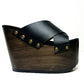 Jet black handmade leather wedge mule sandals with old-gold studs and 15 cm polished wooden wedge by Sol Caleyo.
