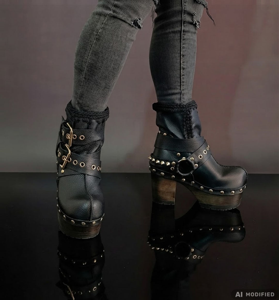 Black leather platform boots with silver studs. Black leather biker style boots with buckles. Black leather ankle boots with vintage style buckles. Leather boots with wooden heel. High-end handmade footwear by Sol Caleyo.