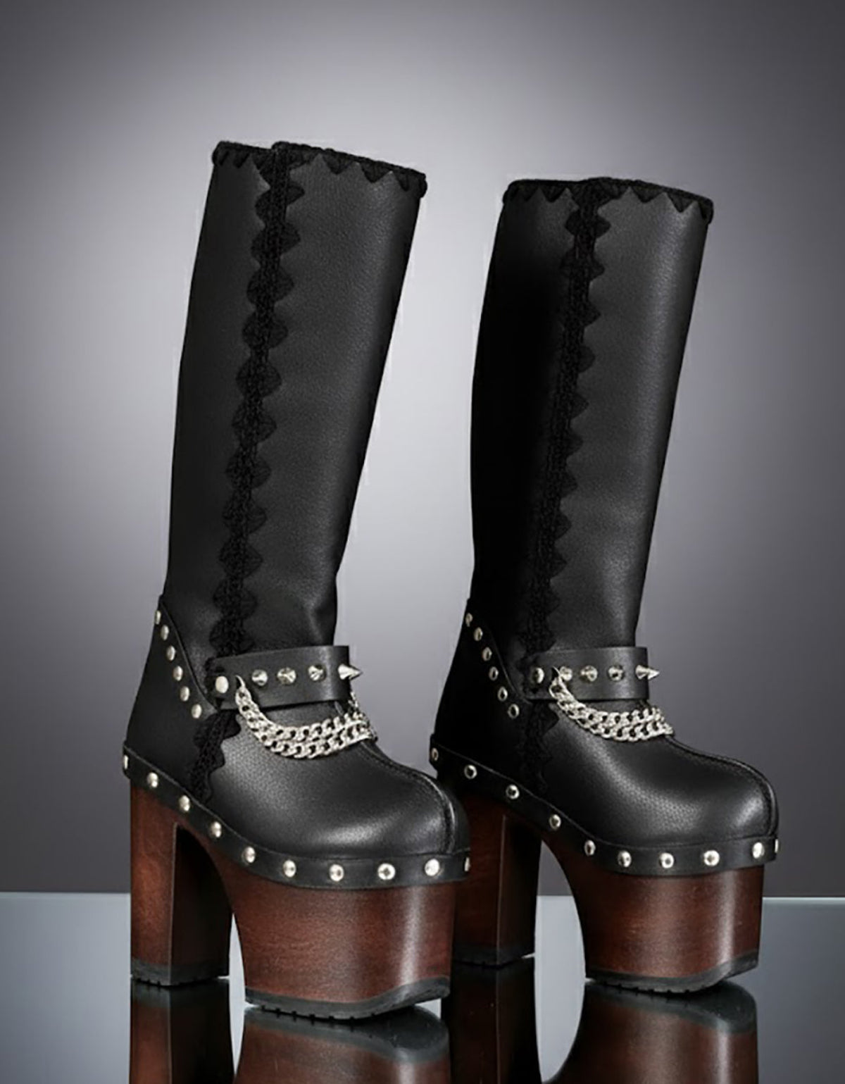 Handmade leather platform boots with silver pyramid studs, chains and 15 cm wenge wooden heel by Sol Caleyo