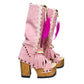 Close-up of Rhapsody Bohemia Pink Boots in premium pink suede with fringe, hand-selected feathers, and organic shells. These artisanal boho boots by Sol Caleyo feature a high hand-sculpted wooden heel and platform.