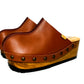 Brown handmade leather wedge mule clogs with old-gold studs and wooden wedge sole by Sol Caleyo