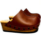 Brown handmade leather wedge mule clogs with old-gold studs and wooden wedge sole by Sol Caleyo