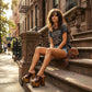Model wearing the Brown Luxury Queen Sandals by Sol Caleyo, showcasing the 17 cm wooden platform and deep brown leather straps for a sophisticated, high-fashion look.