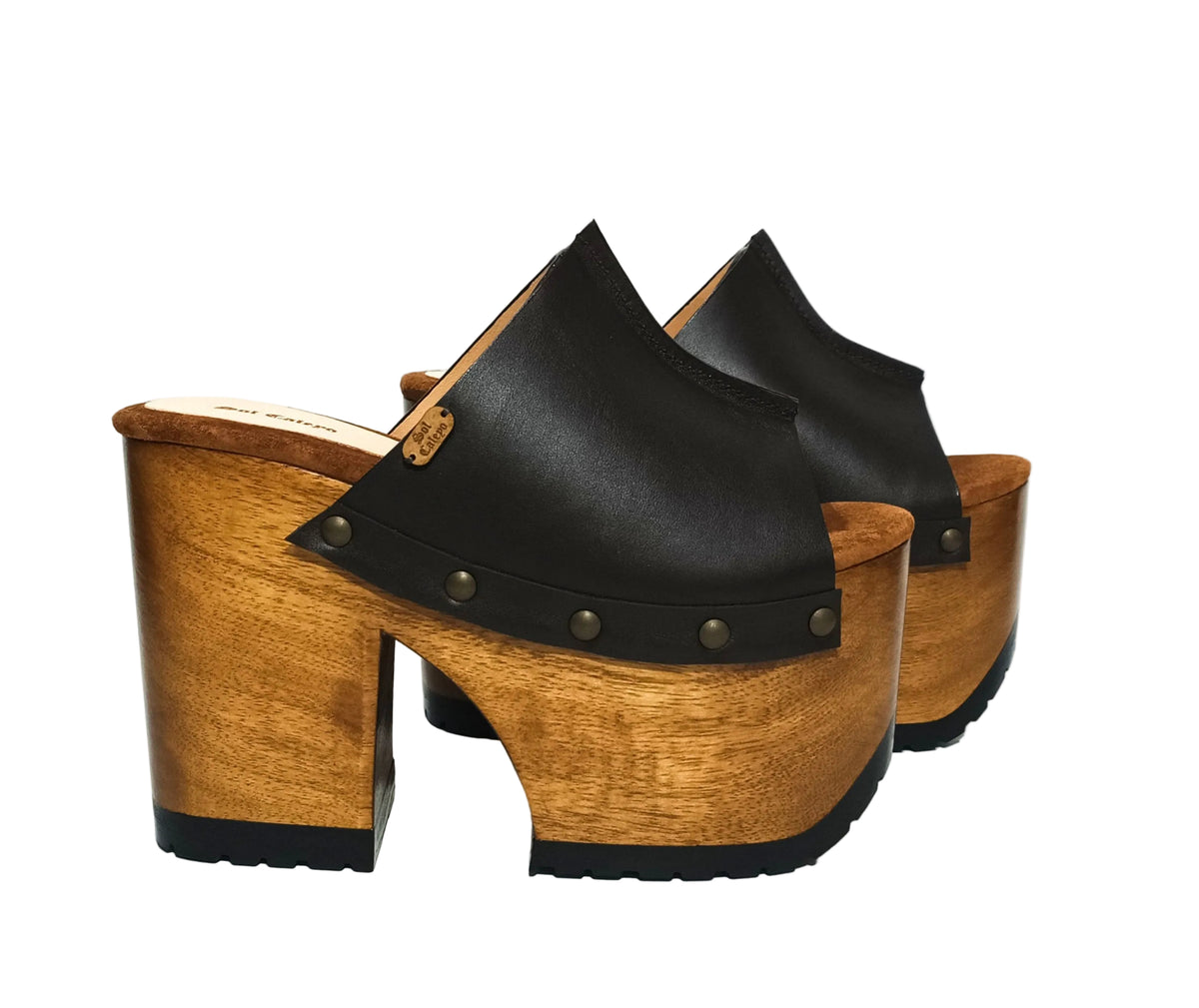 Handmade dark brown platform mules with a wide instep strap and open toe, made in Spain