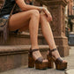 Chocolate brown handmade leather platform sandals with ankle strap, bronze-tone studs and 17 cm dark wooden heel by Sol Caleyo