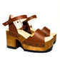 Handmade smooth camel leather platform sandals with wide ankle strap and 8 cm natural lacquered wooden heel by Sol Caleyo.