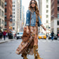 Handmade camel suede tall platform boots with hand-painted buffalo skull, side fringe, shells and feathers on a 9 cm lacquered wooden heel by Sol Caleyo.