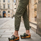 Handmade camo print open-back wedge mule clogs with antique-gold studs and 7 cm wooden wedge by Sol Caleyo.