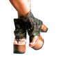 Handmade military green and brown camo print leather flip flop platform booties with old-gold pyramid studs, two front chains and 10 cm natural lacquered wooden heel by Sol Caleyo.