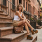 Handmade camouflage leather mule clogs with studs and 17 cm bell-style hand-carved wooden heel by Sol Caleyo.