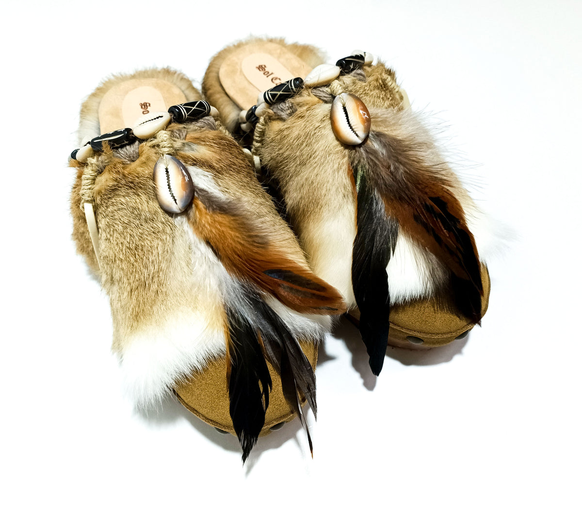 Handmade boho suede platform clogs with rabbit fur, carved bone, shells and feathers by Sol Caleyo