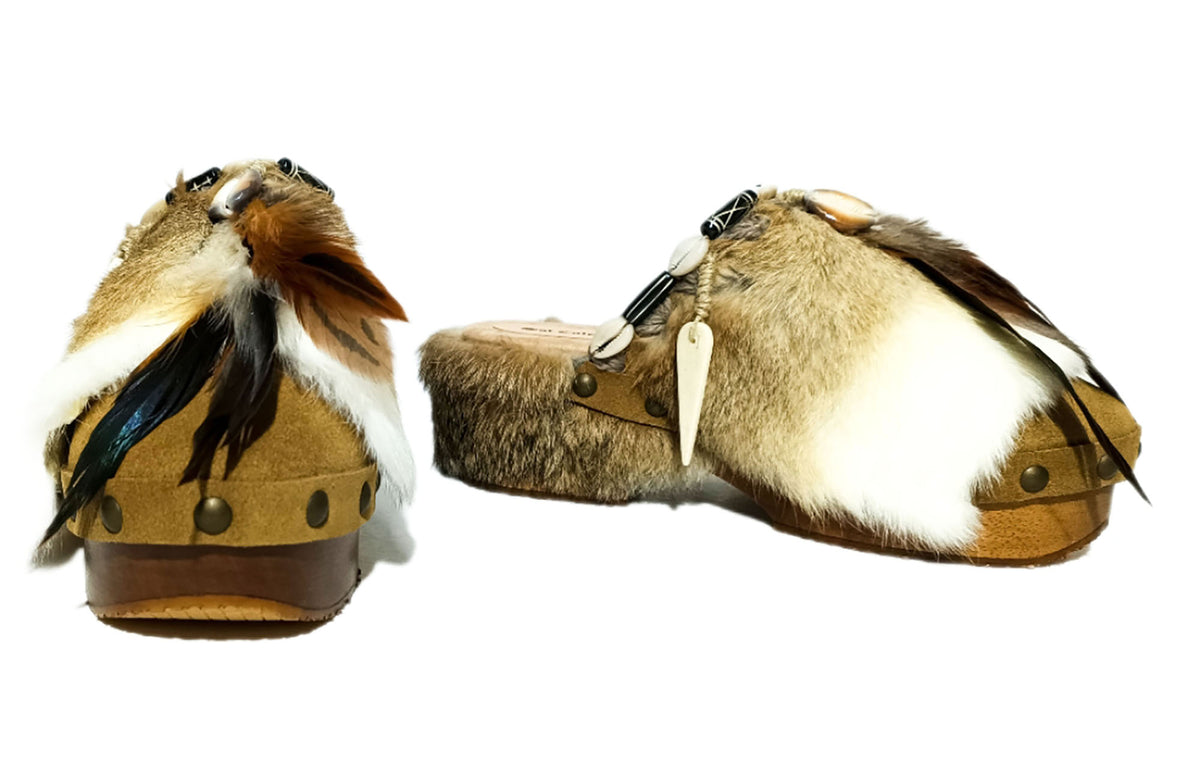 Handmade boho suede platform clogs with rabbit fur, carved bone, shells and feathers by Sol Caleyo