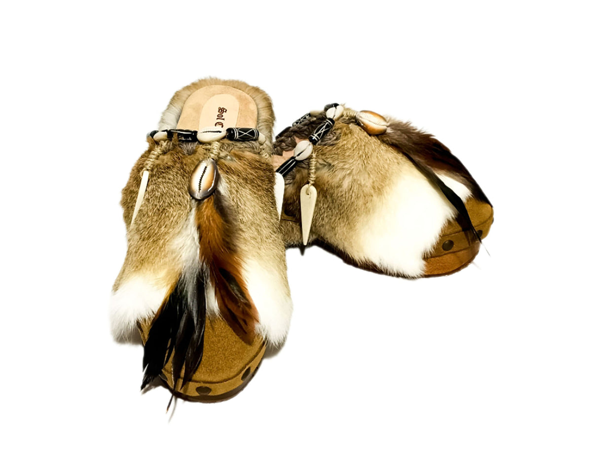 Handmade boho suede platform clogs with rabbit fur, carved bone, shells and feathers by Sol Caleyo